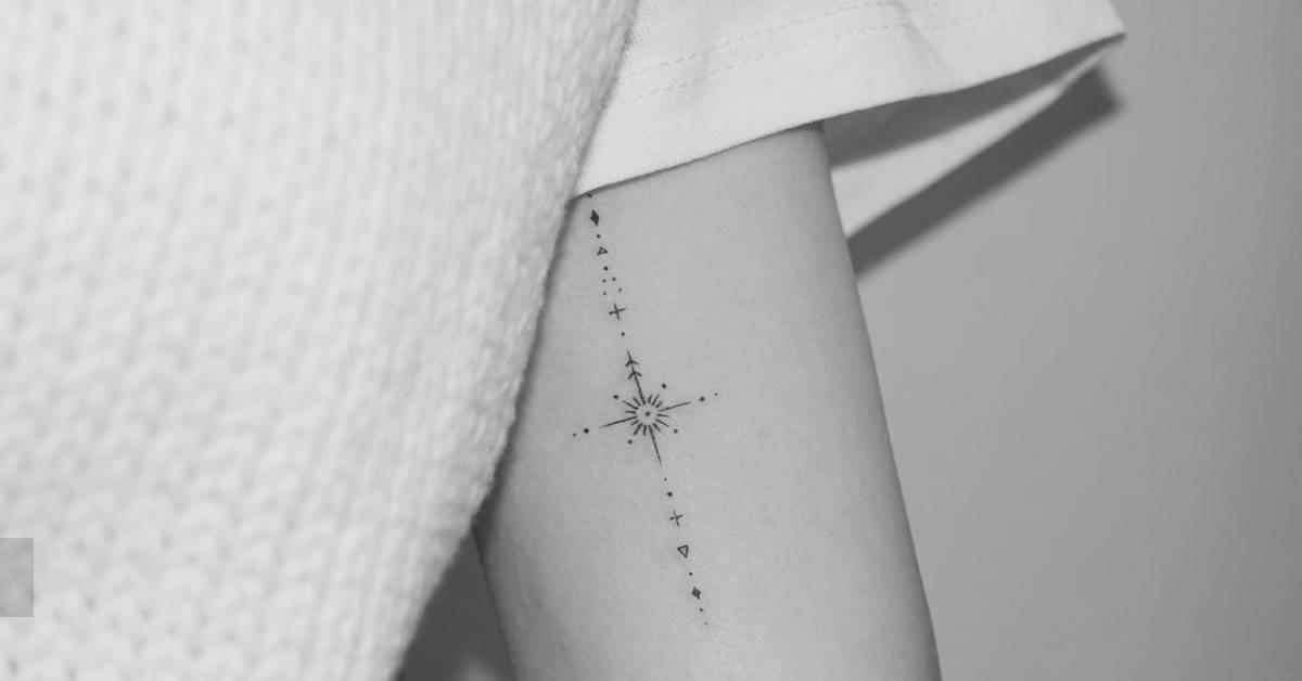 Fine line style ornamental tattoo located on the inner