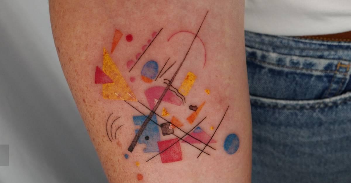 Watercolor style abstract tattoo located on the inner