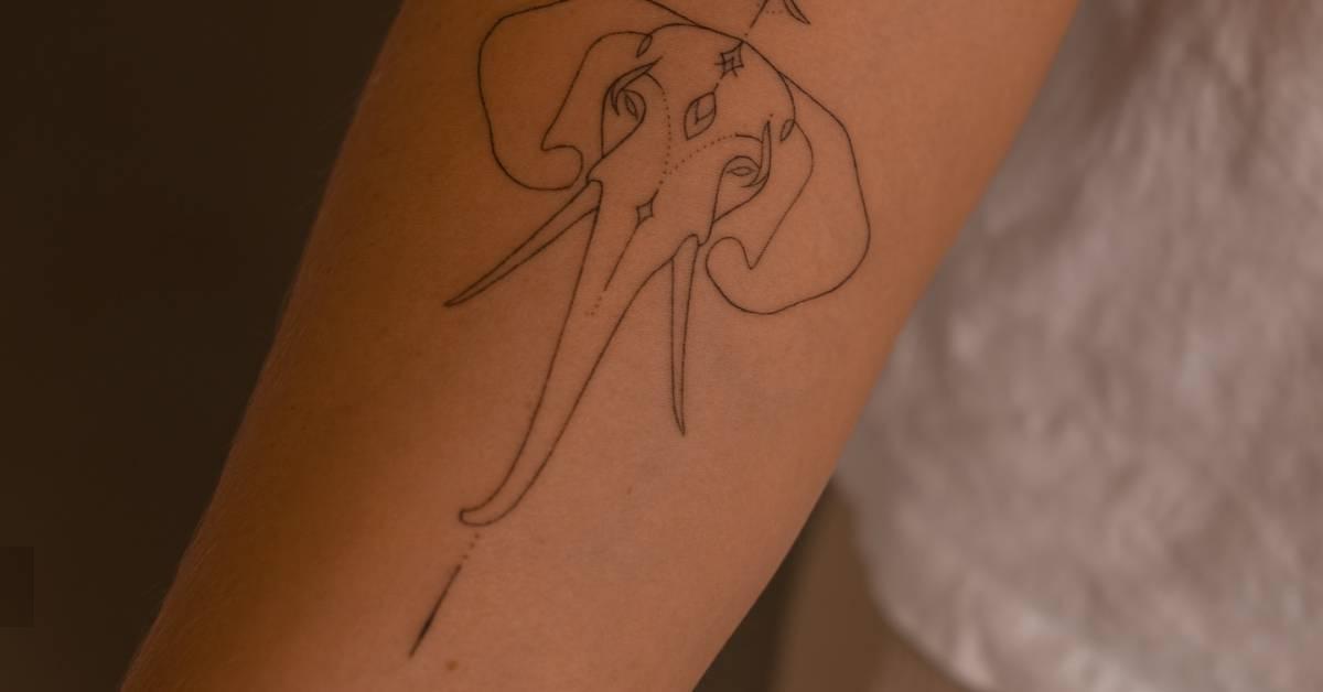 Hand poked elephant portrait tattoo located on the