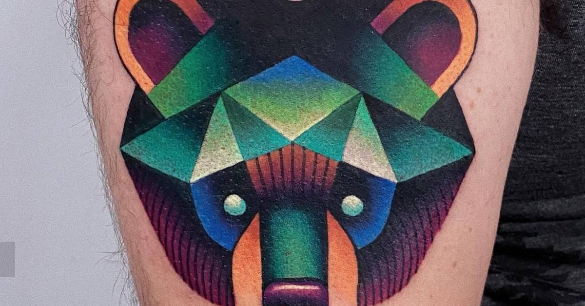 Pop art style bear portrait tattoo located on the upper