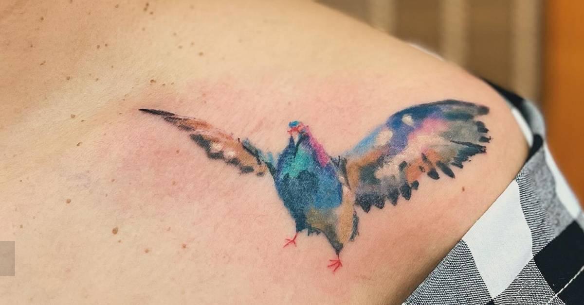 Pigeon tattoo placed on the collarbone, done in