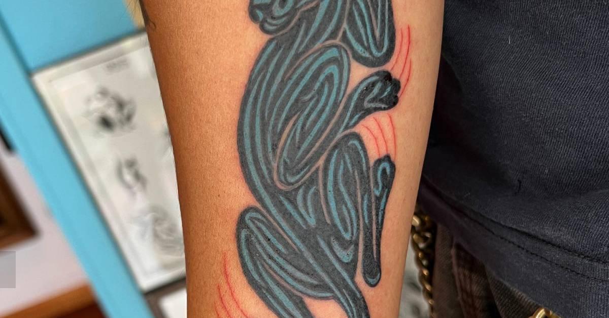 Panther tattoo located on the inner forearm,