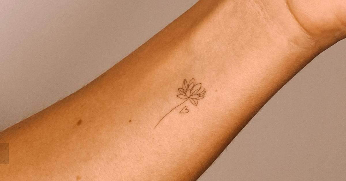 Little lotus flower tattoo located on the wrist, done