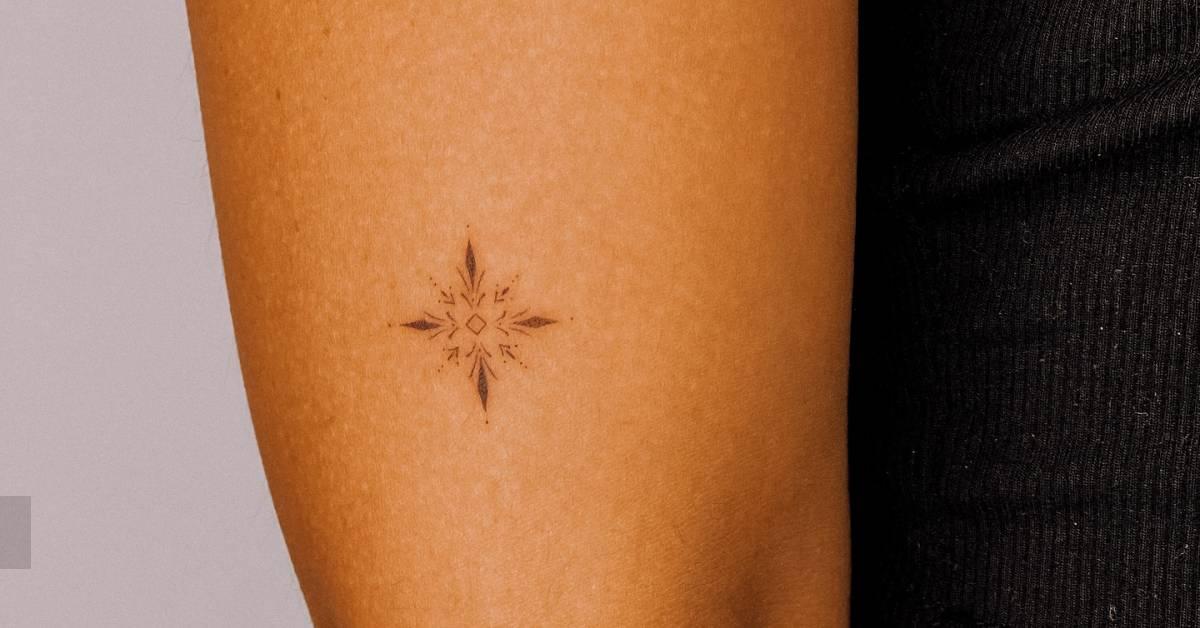 Ornamental tattoo in fine line style located on the