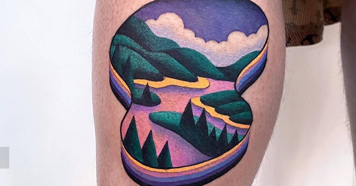 Pop art style landscape tattoo located on the calf.