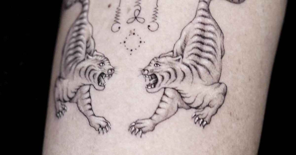 Tigers tattoo in illustrative style located on the