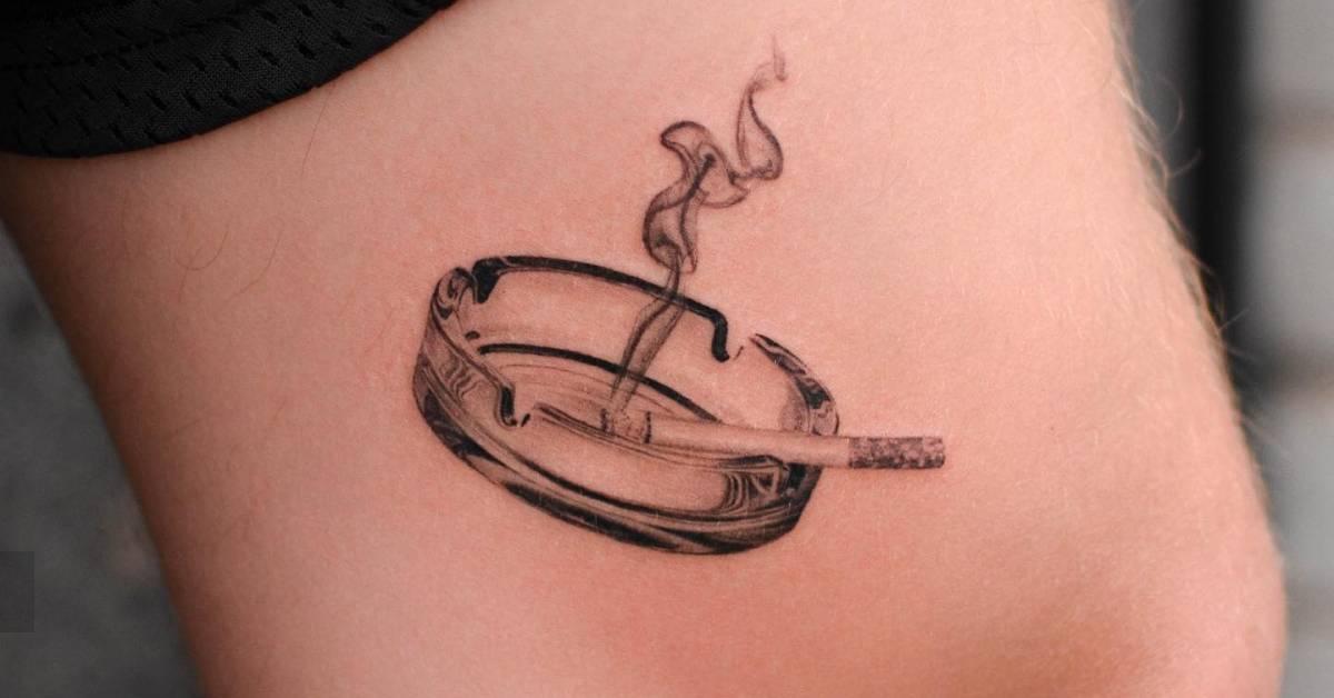 Micro-realistic style ashtray tattoo located on the
