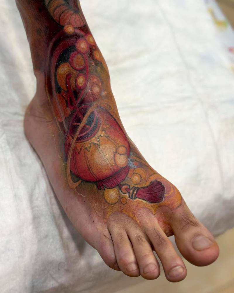 Neotraditional style lantern tattoo located on the foot.
