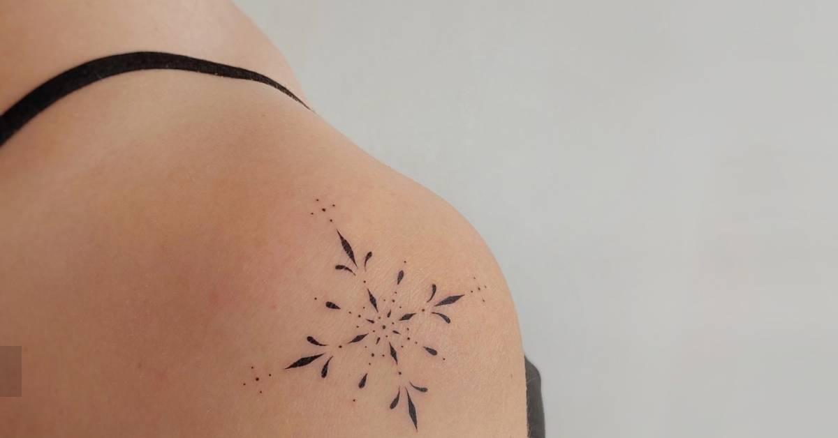 Ornamental tattoo in fine line style located on the