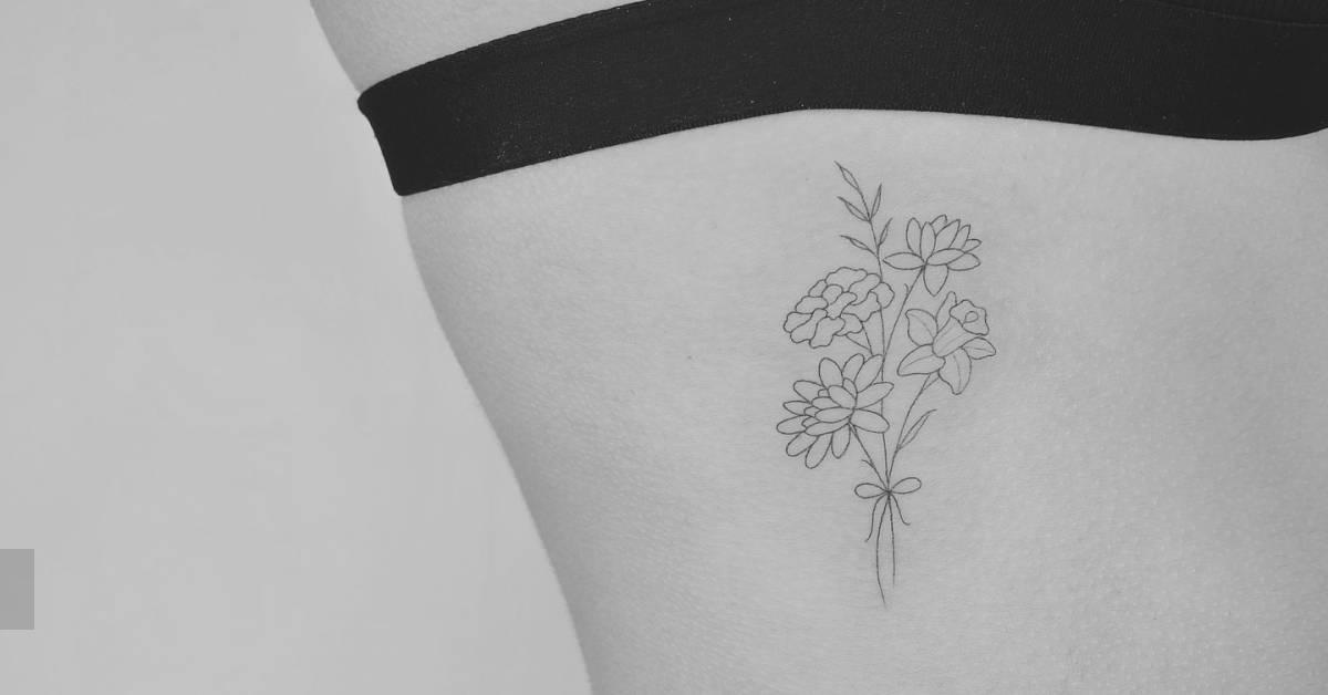 Flower bouquet tattoo in fine line style located on the