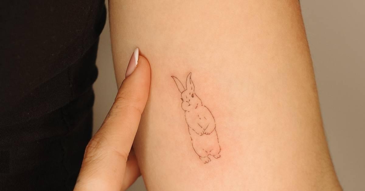 Fine line style rabbit tattoo placed on the inner arm.
