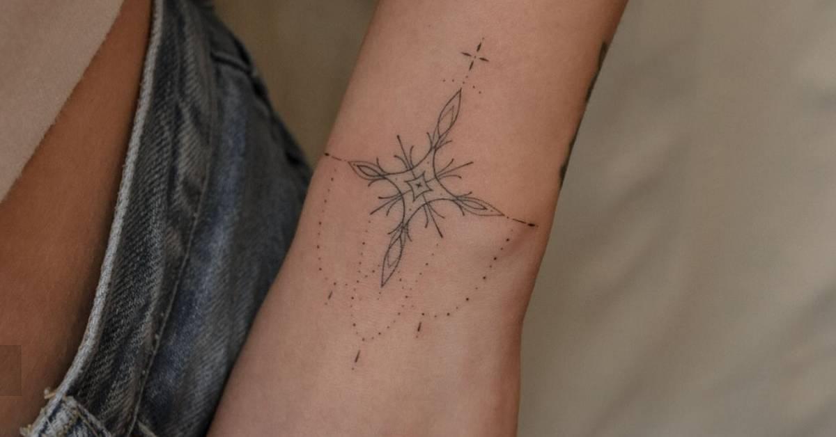 Ornamental tattoo in fine line style located on the