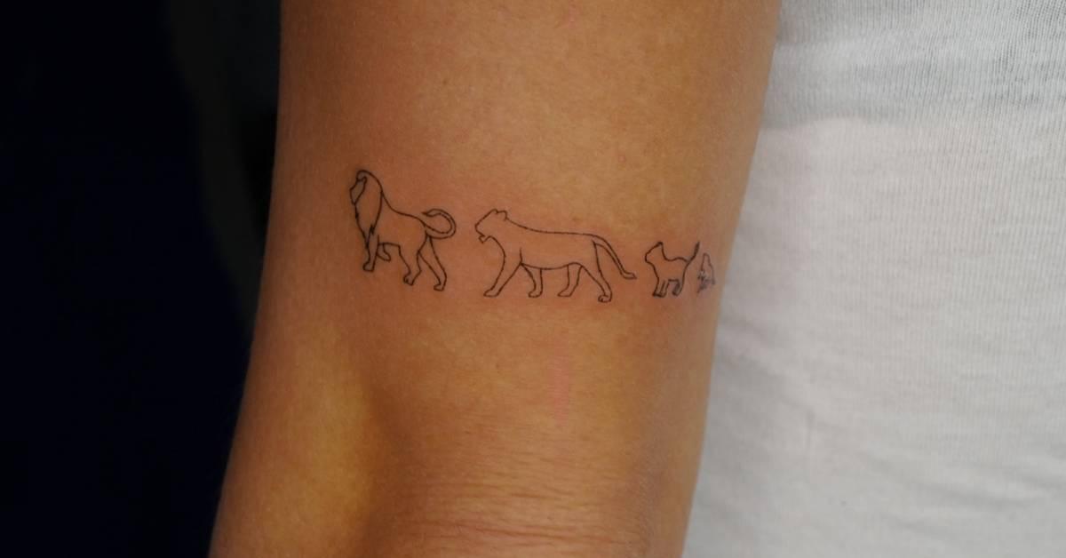 Fine line style lion family tattoo located on the