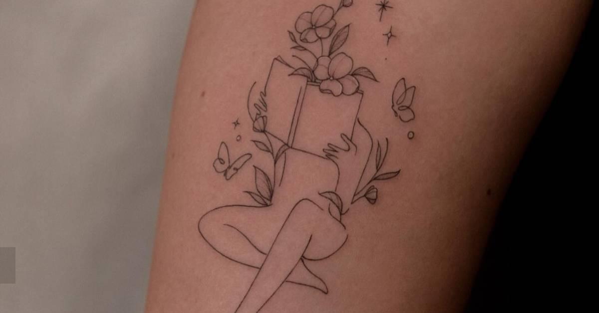 Flower head woman tattoo in fine line style located on