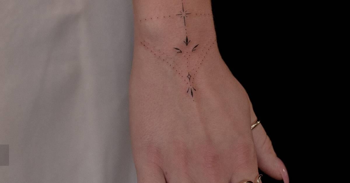 Ornamental tattoo in fine line style located on the