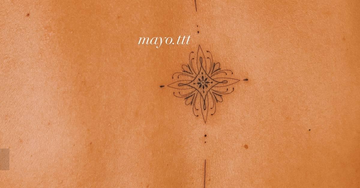Ornamental tattoo in fine line style located on the