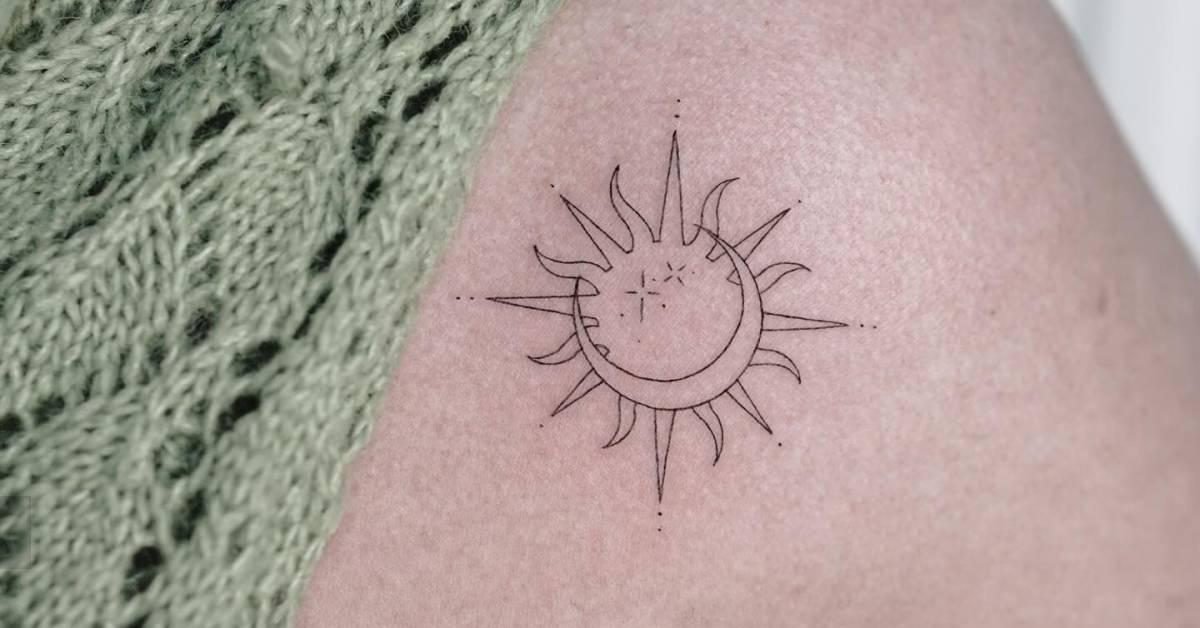 Sun and moon tattoo in fine line style located on the