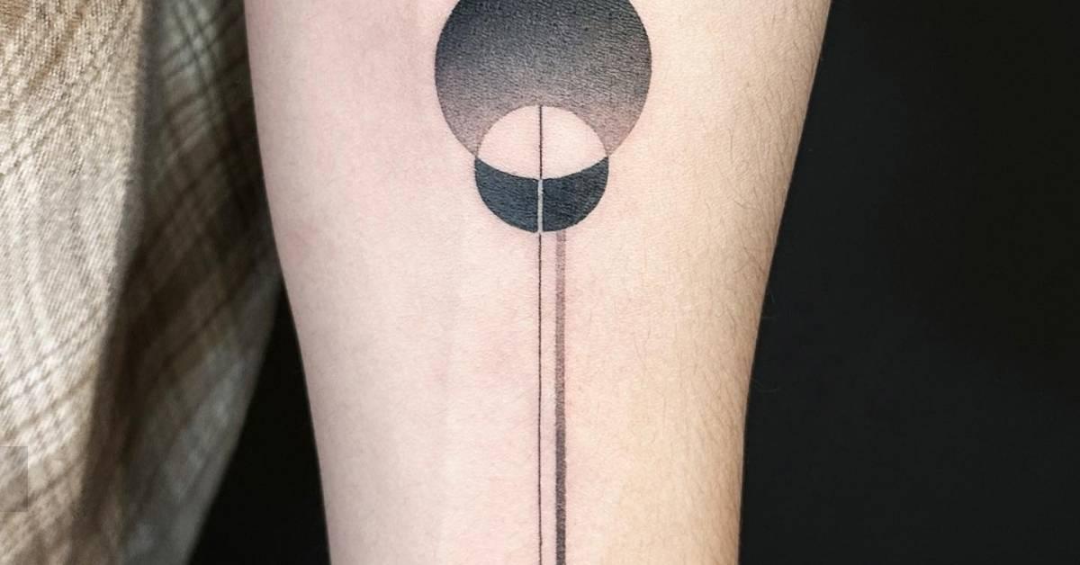 Abstract geometric tattoo located on the inner forearm.