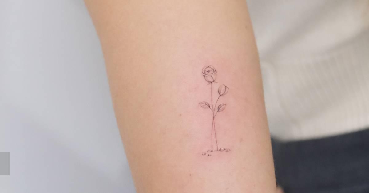 Single needle roses tattoo located on the tricep.