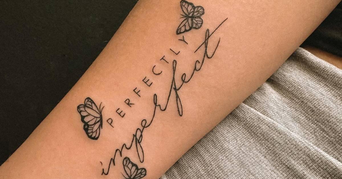 "Perfectly imperfect" and butterflies tattoo located on