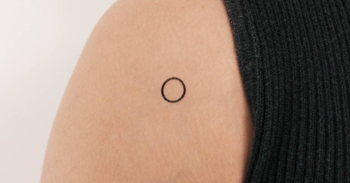 Little minimalistic circle temporary tattoo placed on
