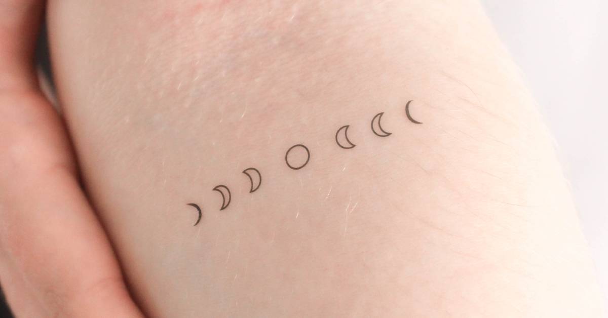 Fine line style moon phases temporary tattoo placed on