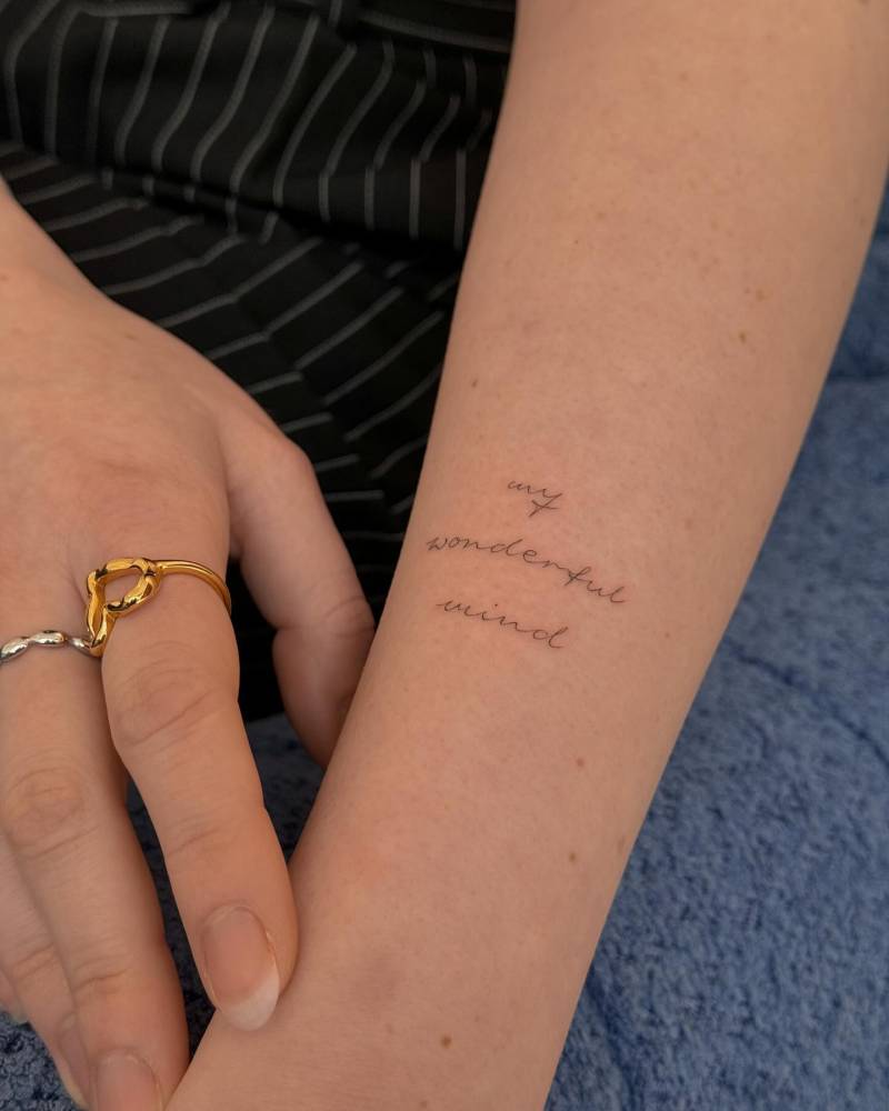 "My wonderful mind" handwritten lettering tattoo located on the forearm.