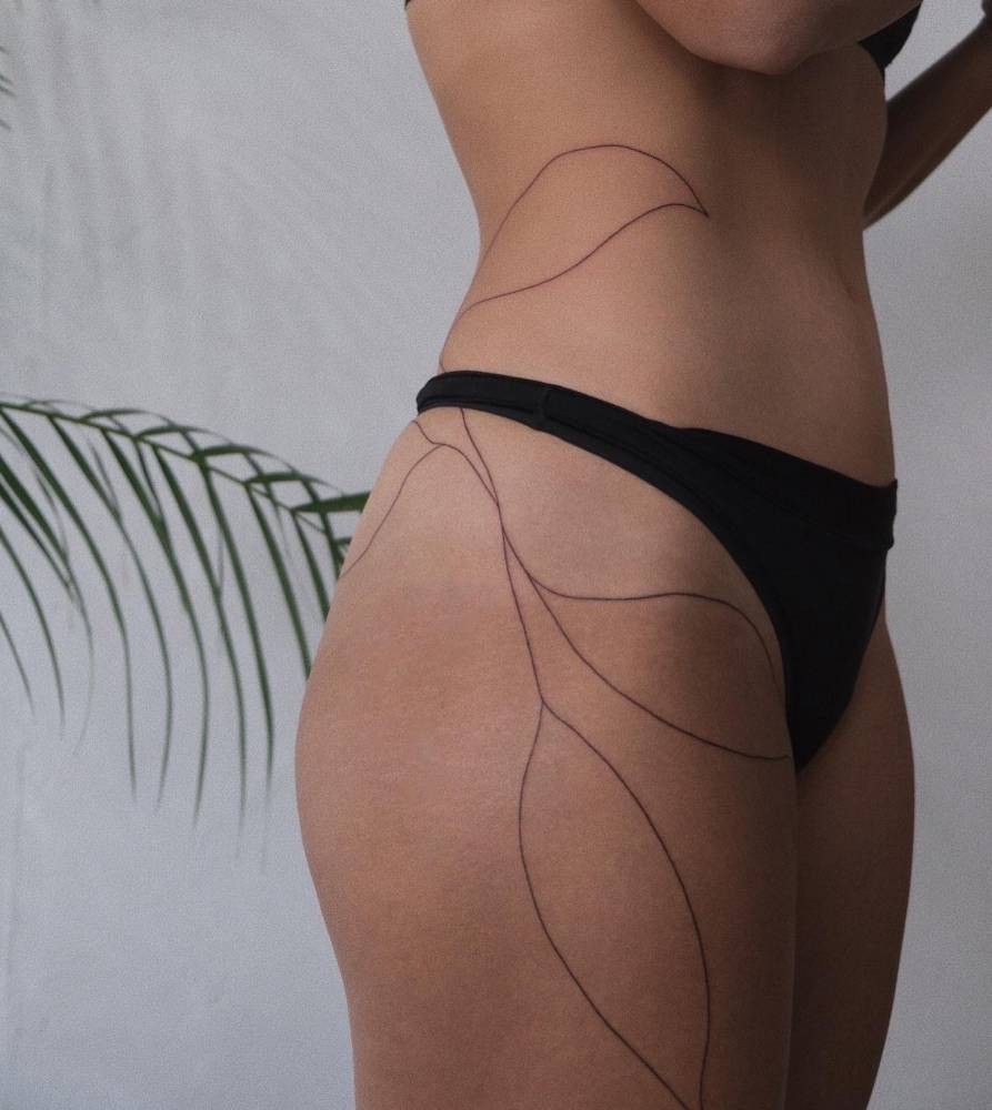 Huge line art style leaves tattoo.