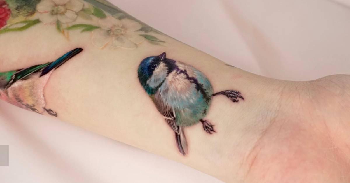 Realistic style long tailed tit tattoo located on the