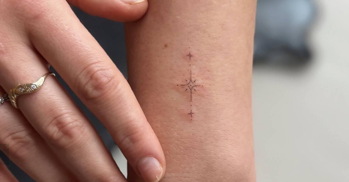 Fine line style ornament tattoo located on the wrist.