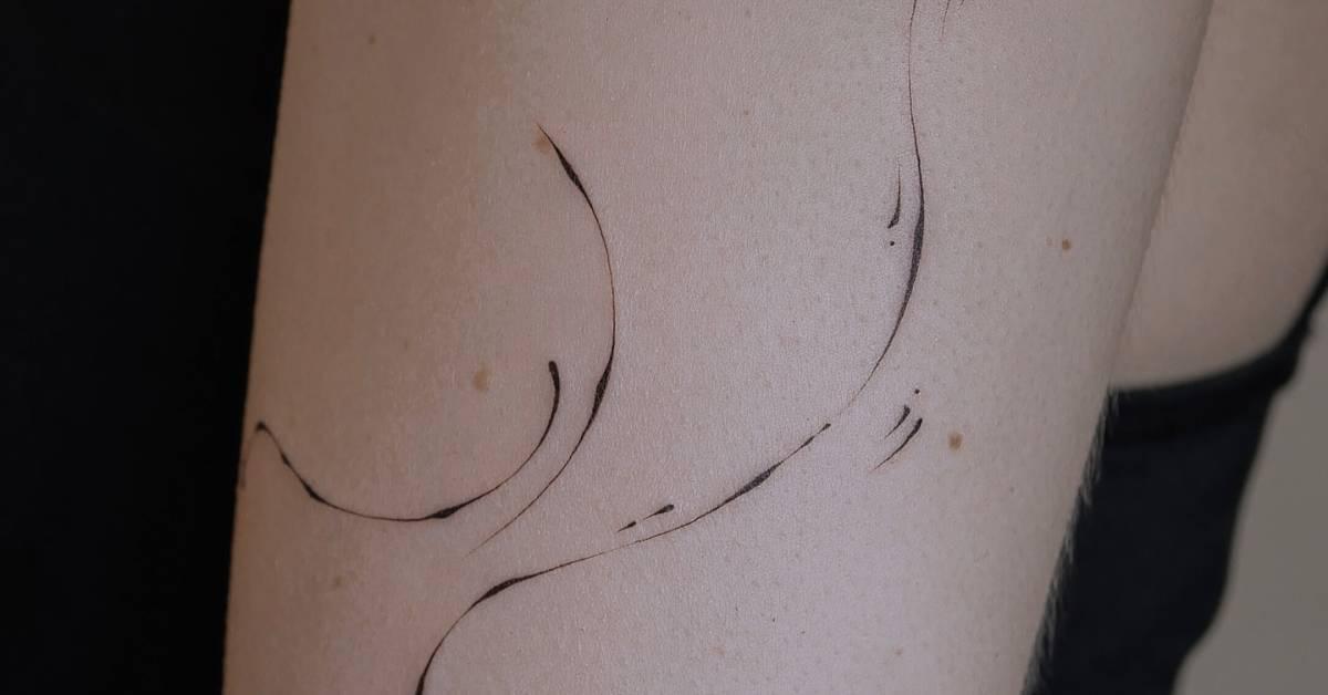 Line art style ornamental tattoo located on the upper