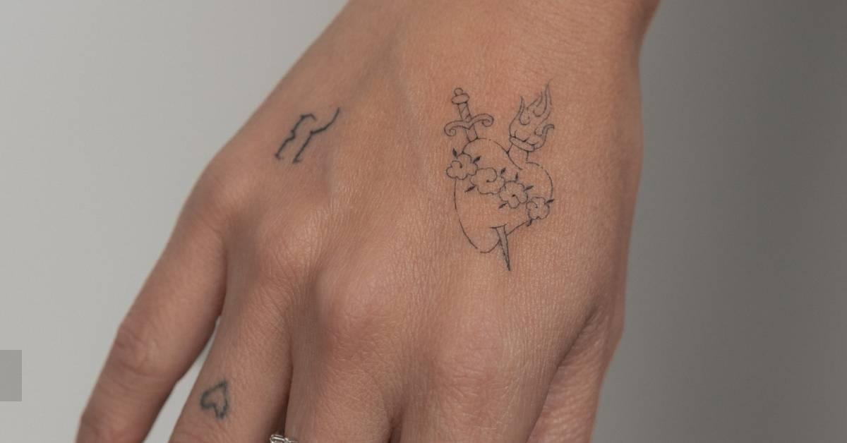 Single needle immaculate heart tattoo located on the