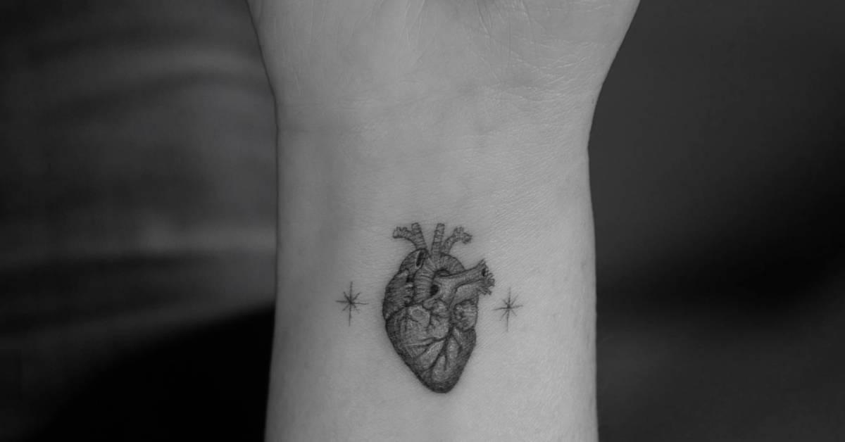 Single needle anatomical heart tattoo located on the