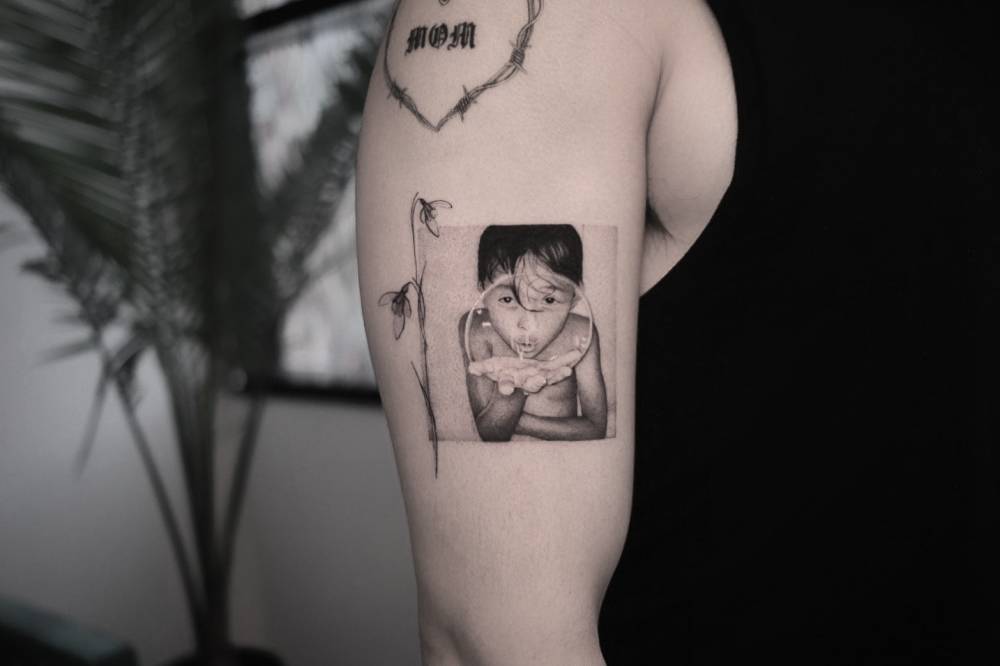 Portrait tattoo of his son located on Florido Basallo's upper arm.