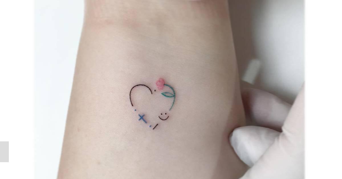 Minimalistic style flower heart tattoo located on the