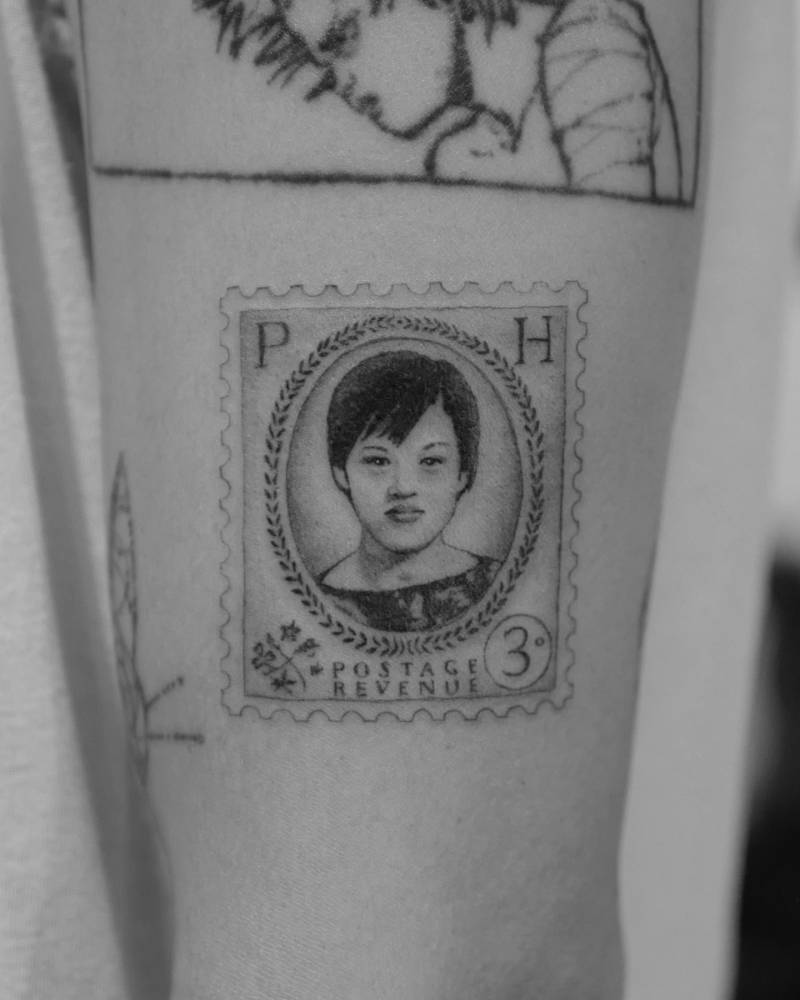 His mom on the postage stamp tattooed on the upper arm.