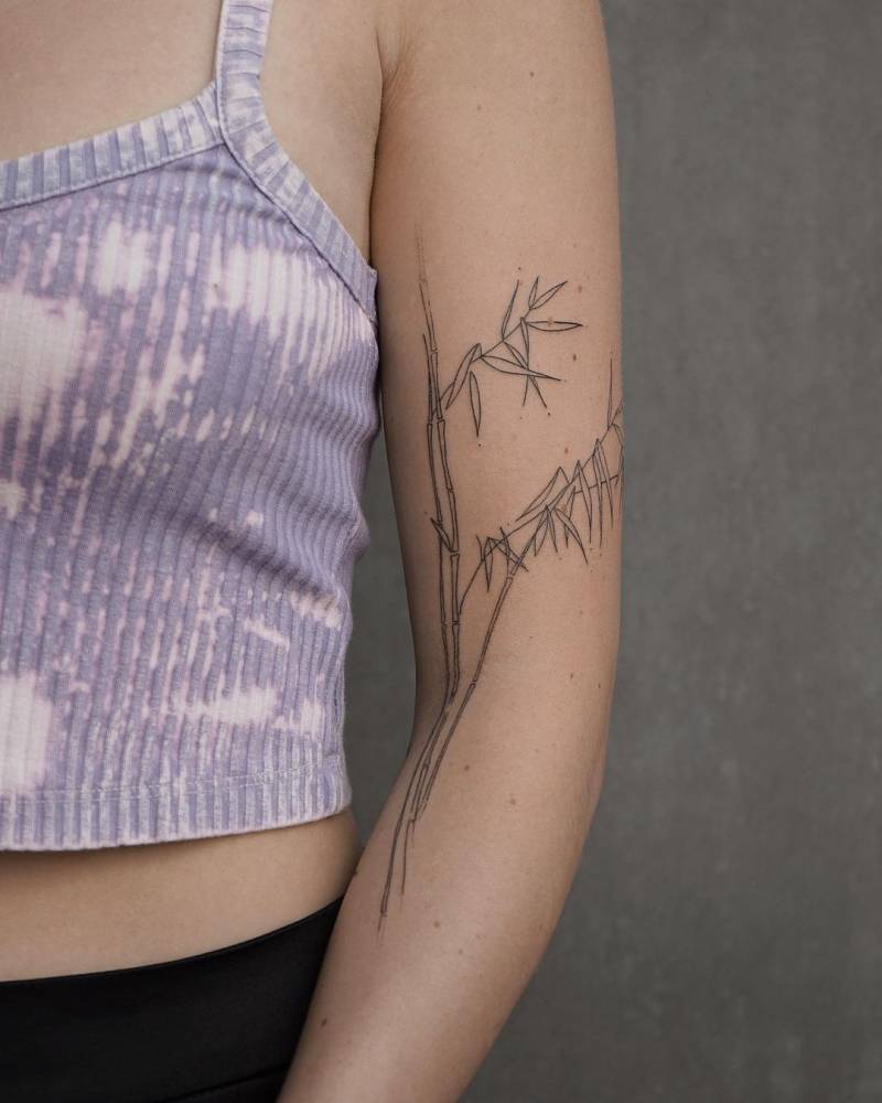 Hand poked bamboo tattoo placed on the arm.