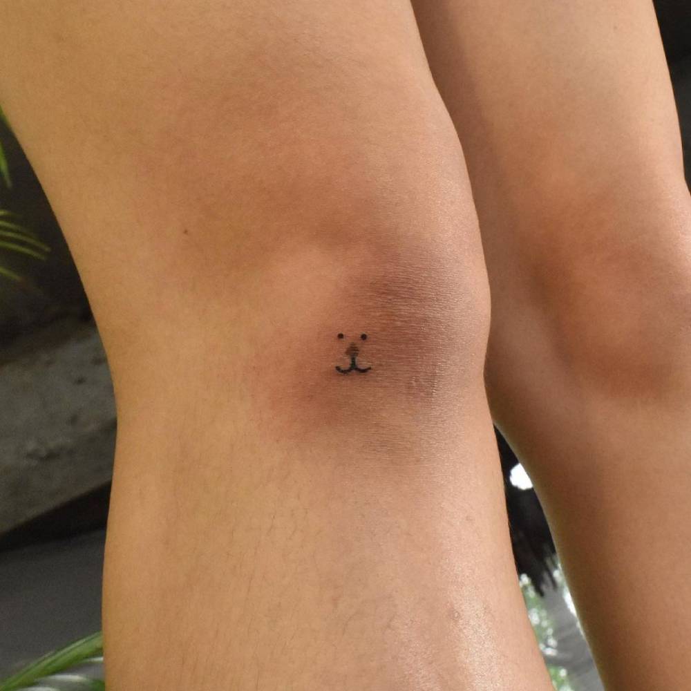 Birthmark cover up bear tattoo on the knee.