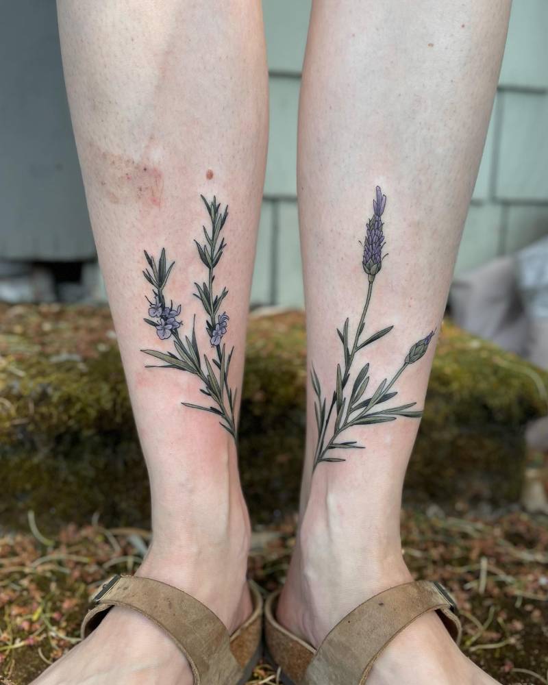 Individual matching lavender flowers tattooed on the shins.