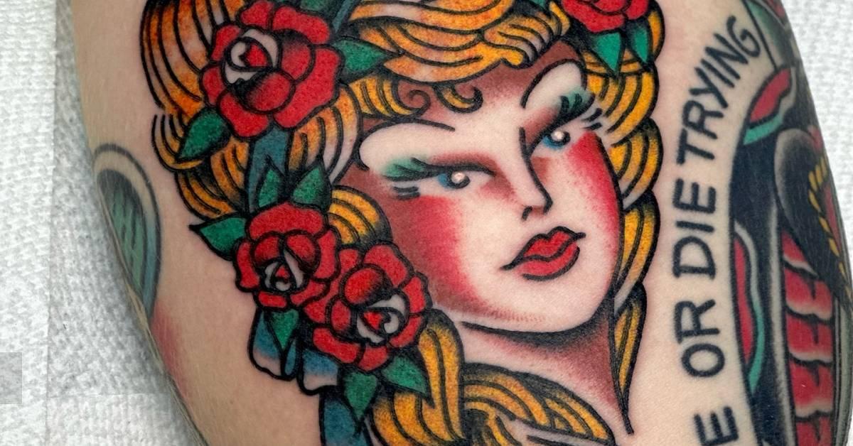 Woman portrait gap filler tattoo in traditional style.