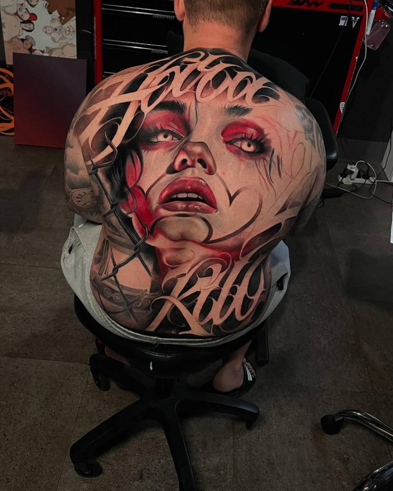 Woman portrait backpiece tattoo in realistic style.