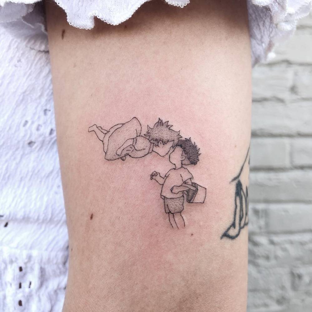 Ponyo and Sosuke tattoo located on the upper arm.