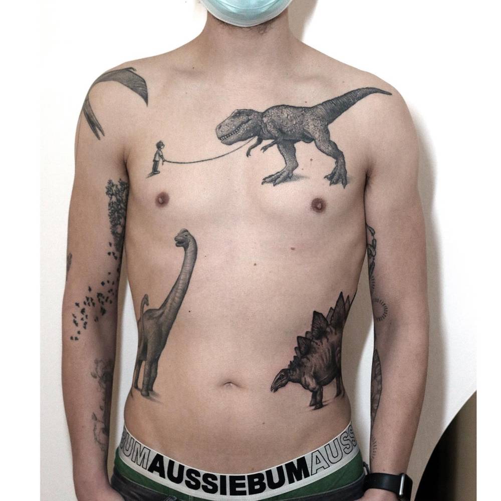 Black and grey style dinosaur collection tattoos located on the torso, stegosaurus fresh and others healed.