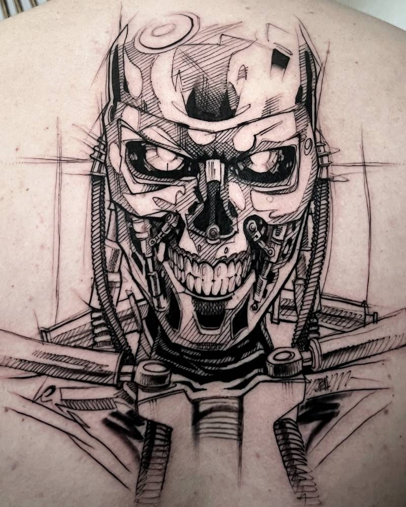 Terminator tattoo located on the back, done in sketch work style.