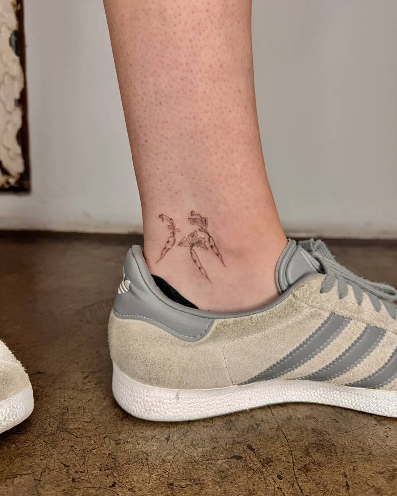 Little carrots tattoo located on the ankle.