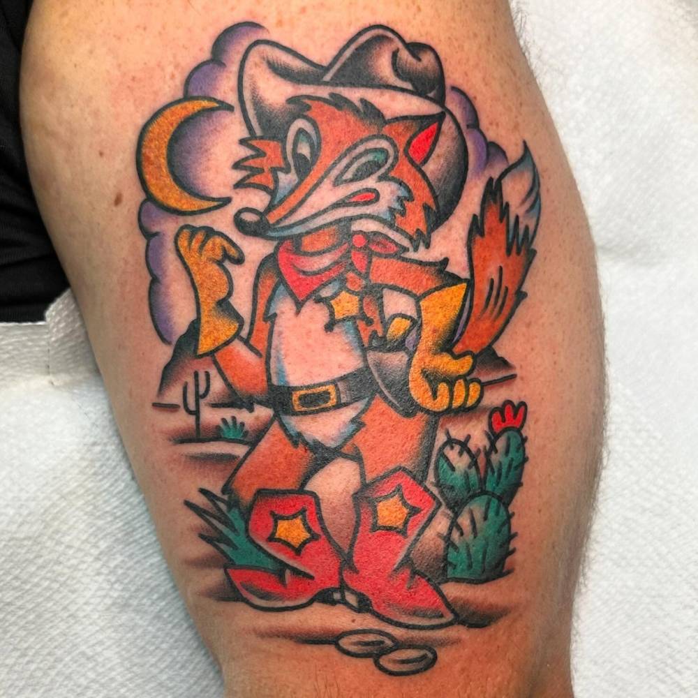 Cowboy fox tattoo located on the thigh, done in traditional style.