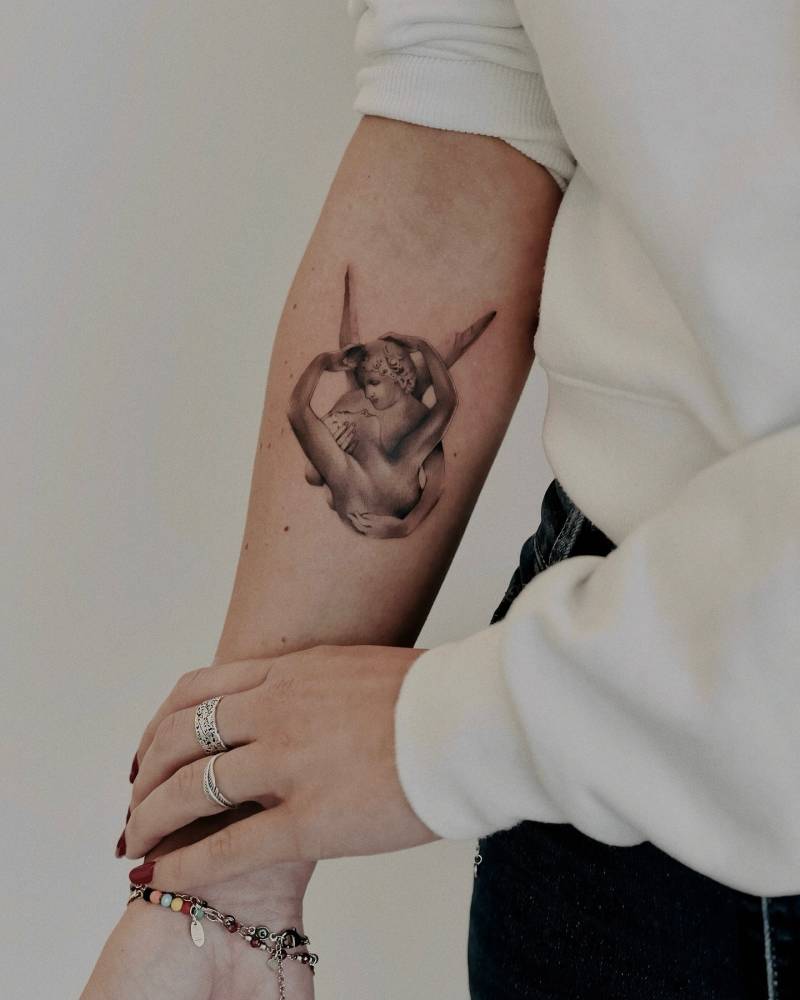 Psyche Revived by Cupid's Kiss tattoo located on the inner forearm.