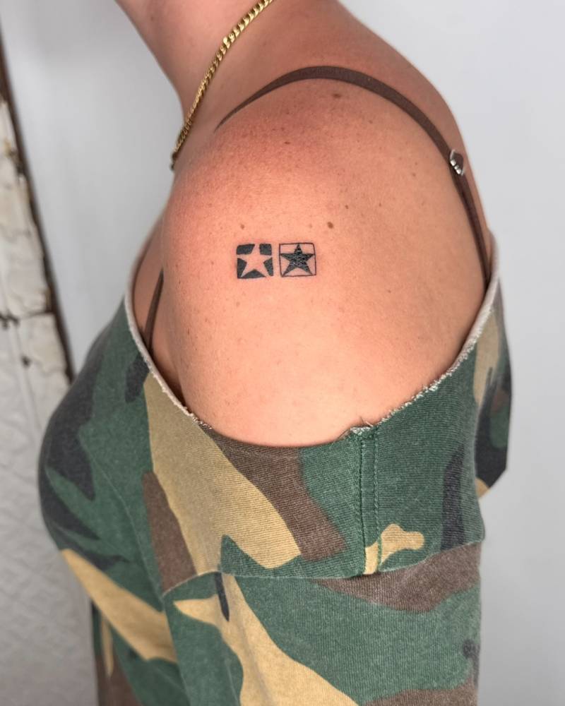 Minimalistic style star tiles tattooed on the shoulder.