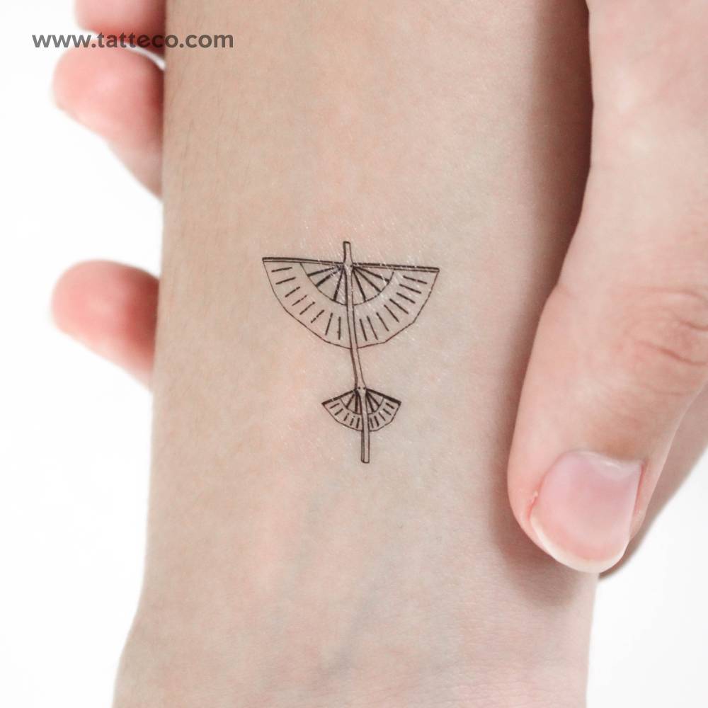 Fine line glider temporary tattoo located on the wrist.