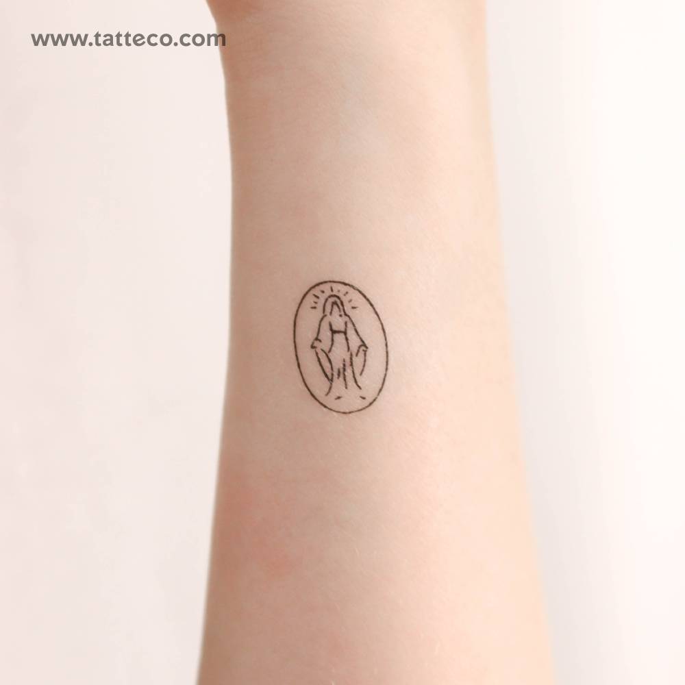 Minimalistic style Virgin Mary temporary tattoo placed on the wrist.